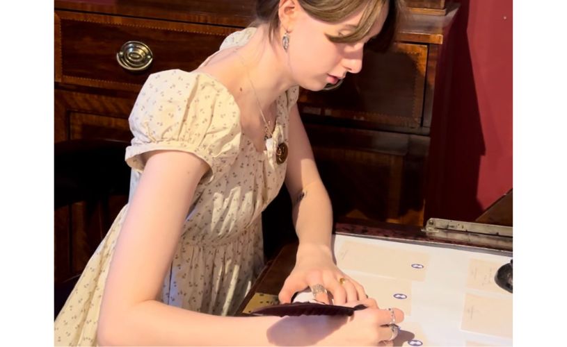 Writing with a quill at the Jane Austen Centre